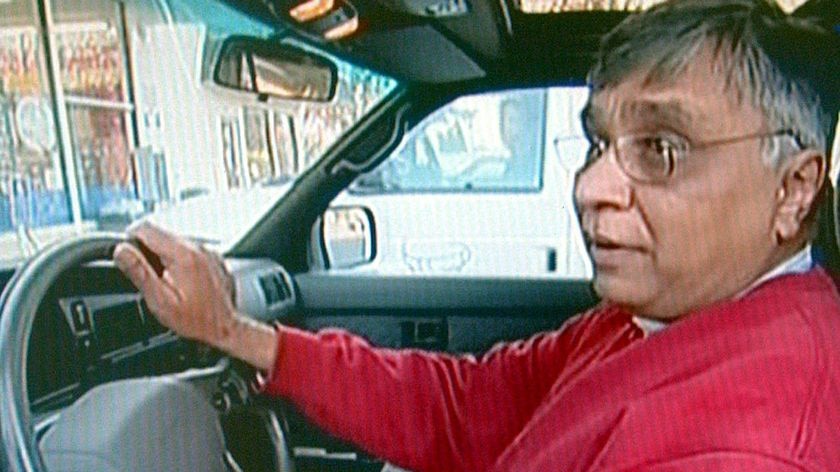 Jayant Patel sits in his car in the US