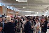 Queues forming at Adelaide Airport as re-screening is undertaken.