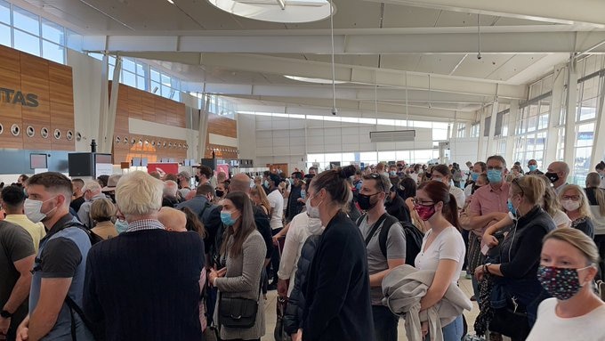 Queues forming at Adelaide Airport as re-screening is undertaken.