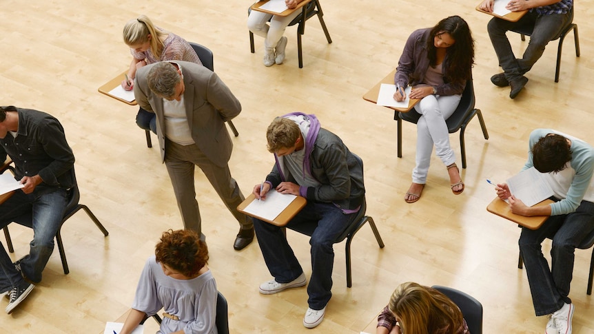 Aerial view of students completing an exam.