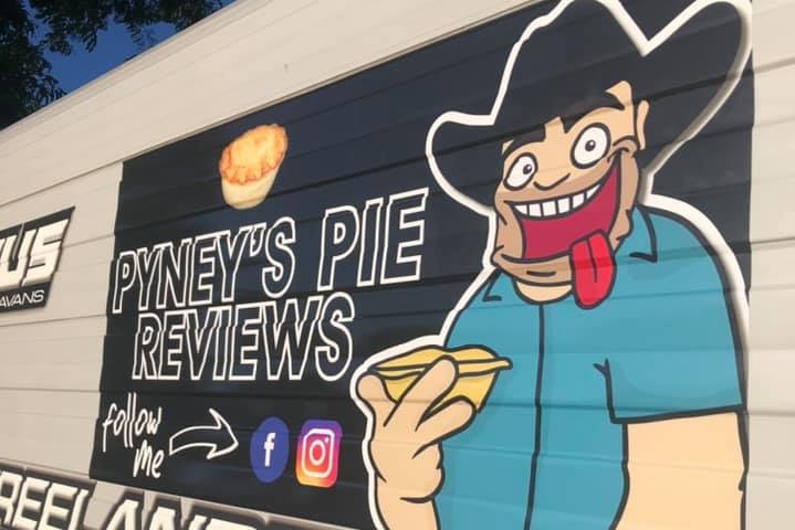 Caravan with the Pyney's pie reviews logo on the side of it