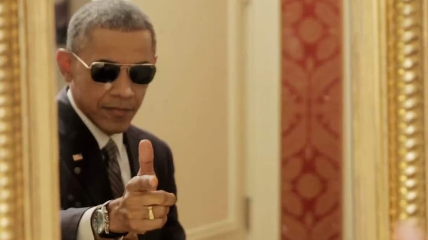 US president Barack Obama poses in front of a mirror in a new Buzzfeed video advertising healthcare