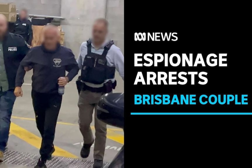 Espionage Arrests. Brisbane couple. Man being escorted by two AFP officers. 