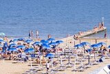 Patrons use the beach at Jesolo, Italy