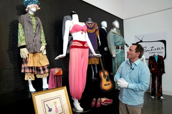 James Comisar looks at the 'I dream of Jeannie' costume as he shows off his collection.