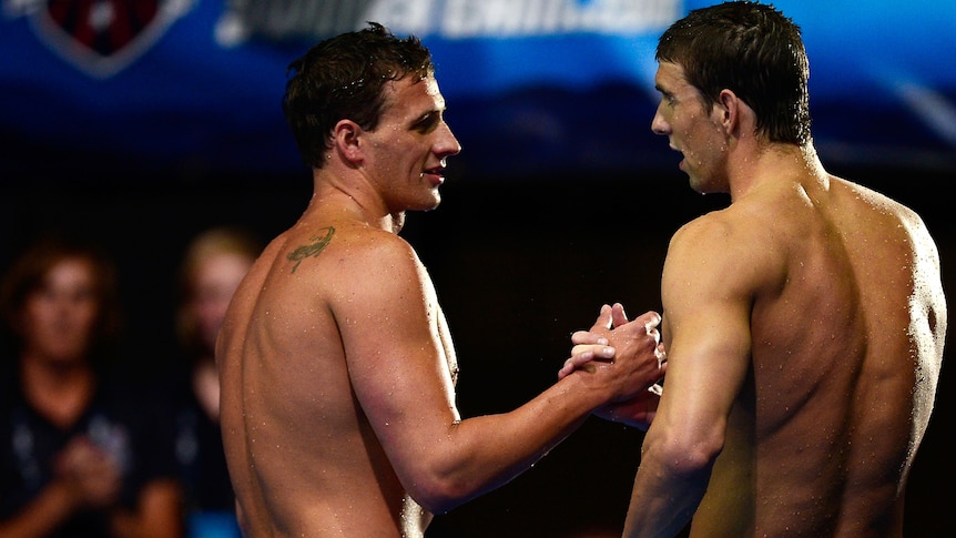 Ryan Lochte and Michael Phelps eye each other at the US Olympic Swim Trials.