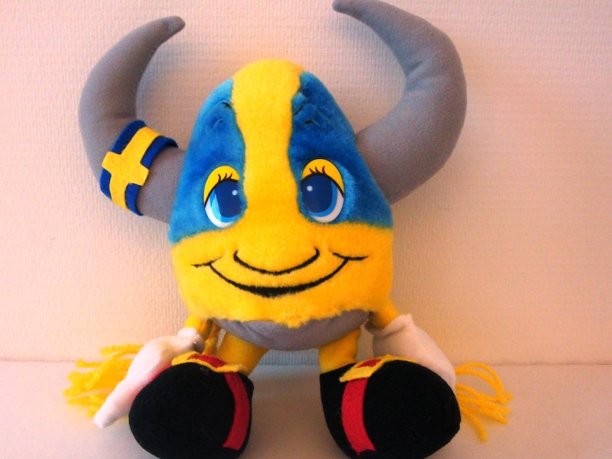 A viking soft toy that is blue and yellow.
