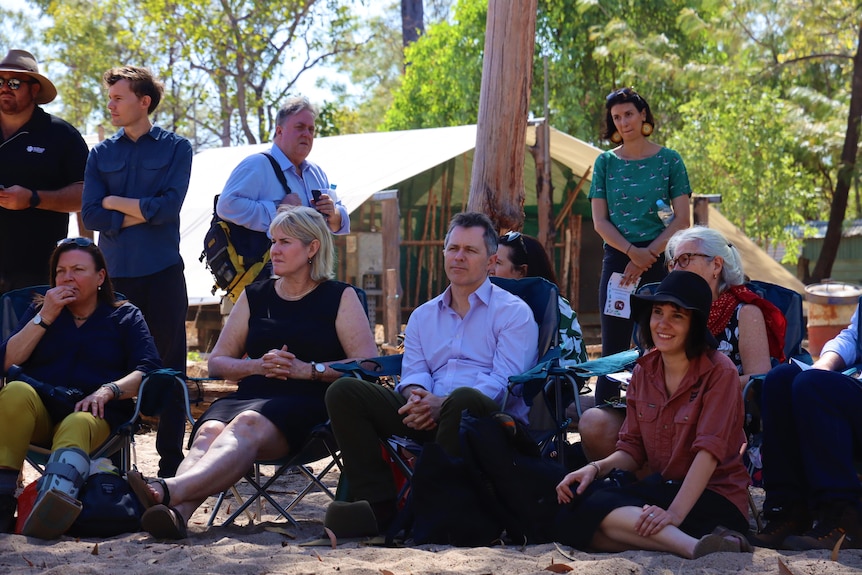 Eva Lawler and Jason Clare sitting down on camp chairs.