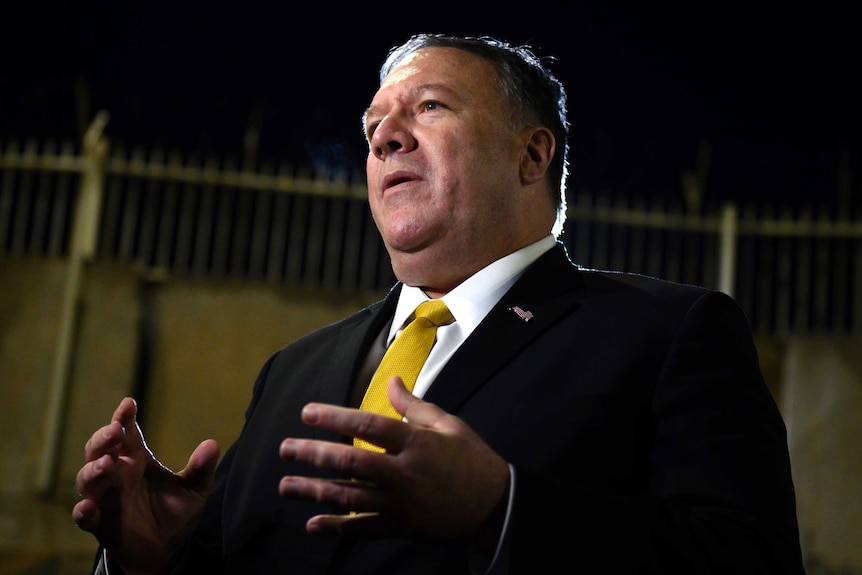 U.S. Secretary of State Mike Pompeo speaks while gesturing his hands.