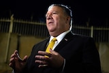 US Secretary of State Mike Pompeo speaks while gesturing his hands.