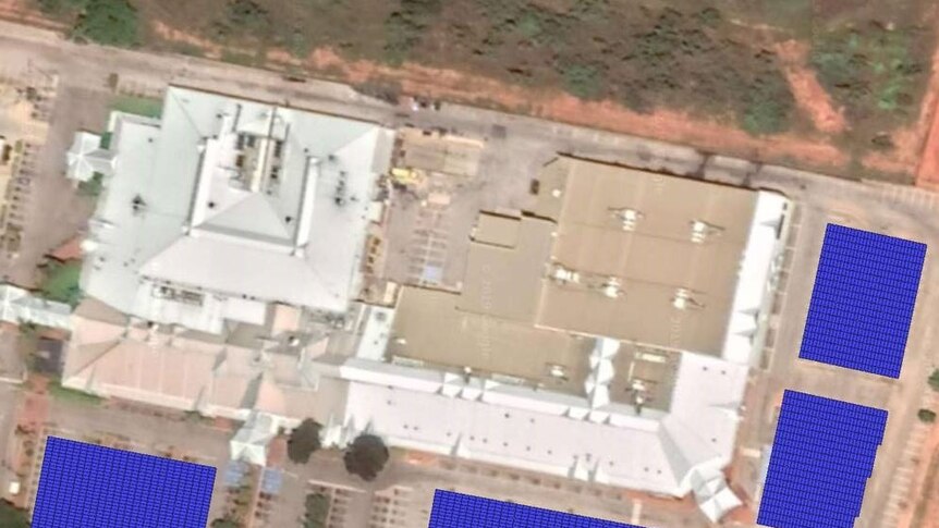 Large blue squares showing where solar panels would go on an aerial view of the car park