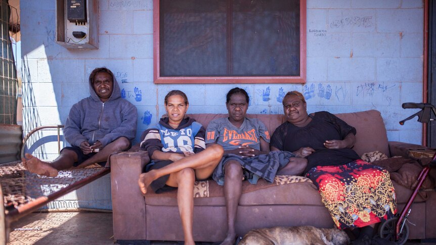 Local women sit outside their home in the remote community of Warburton, WA.