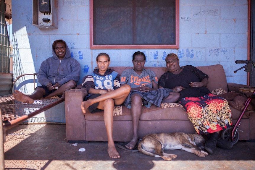 Local women sit outside their home in the remote community of Warburton, WA.