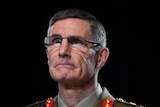 General Angus Campbell wearing glasses and uniform looking left of camera