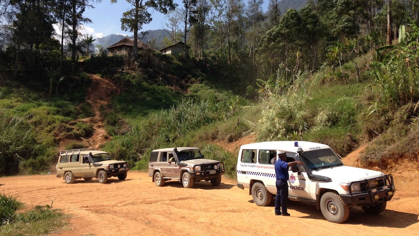 A convoy of land cruisers in the mountains of Papua New Guinea.