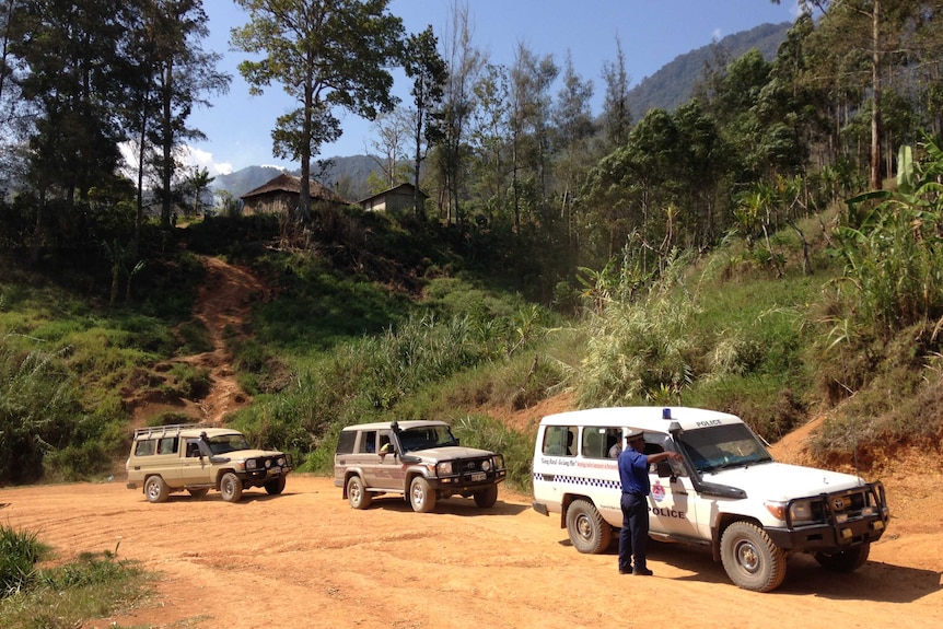 Convoy of aid in land cruisers in the PNG mountains