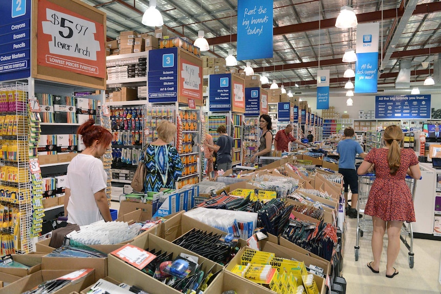 People shop in an Officeworks store