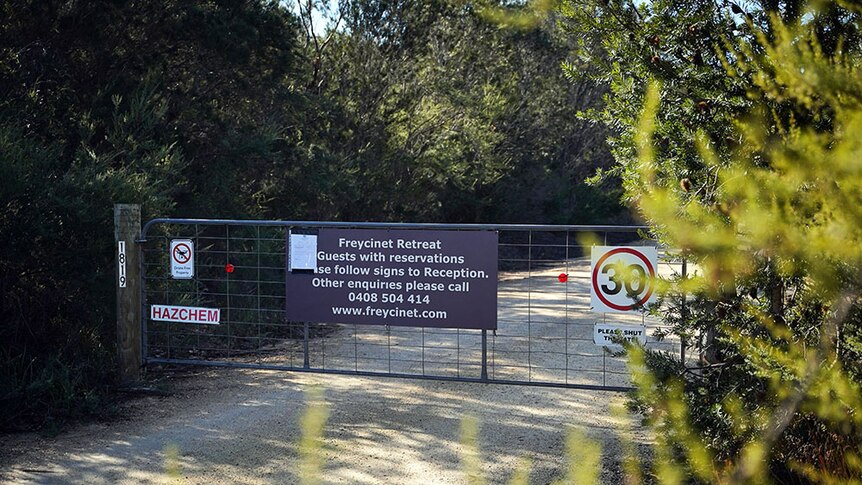 A gate closed at the entrance to Freycinet Resort