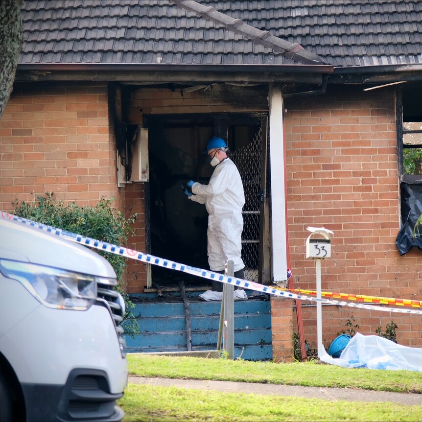 a forensic officer at the property after a fatal fire at lalor park in sydney's west claimed the life of three children