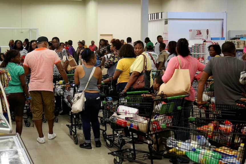 Jamaicans stock up with supplies ahead of Hurricane Matthew.