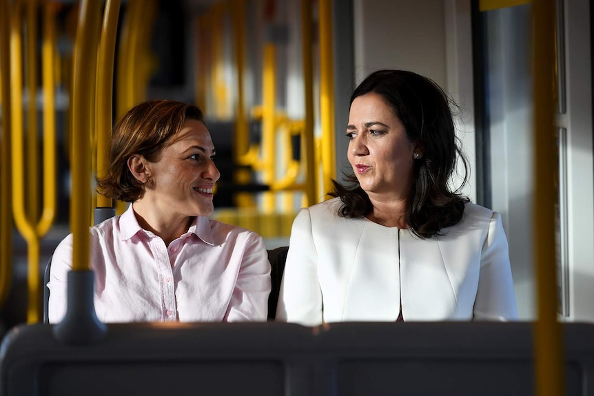 Queensland Premier Annastacia Palaszczuk (right) and Deputy Premier Jackie Trad take a ride on the Light Rail on the Gold Coast.