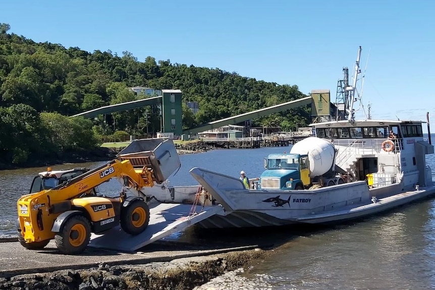 Heavy equipment being loaded onto the barge at Mourilyan Harbour