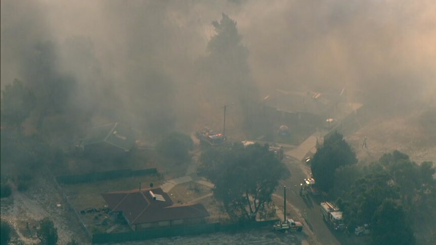 An aerial photo of a fire in a semi-rural area