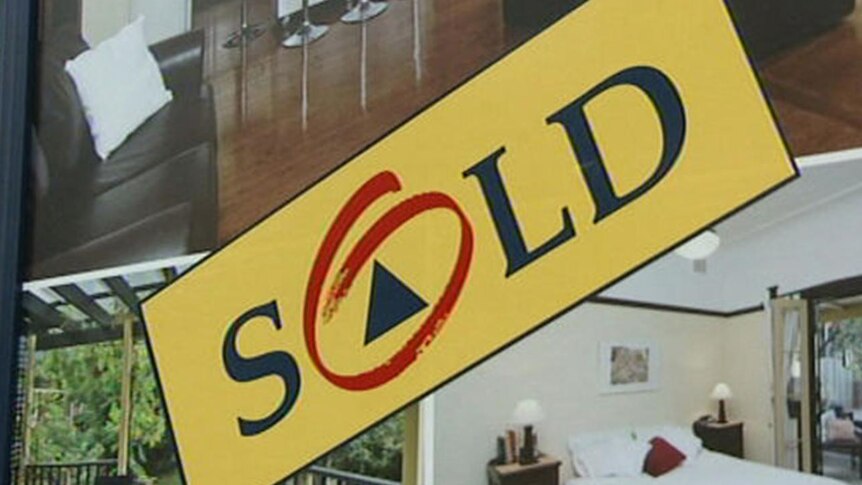 Real estate agent's house sold sign