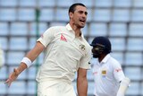 Mitchell Starc nabs the wicket of Jusal Perera on day two of the first Test