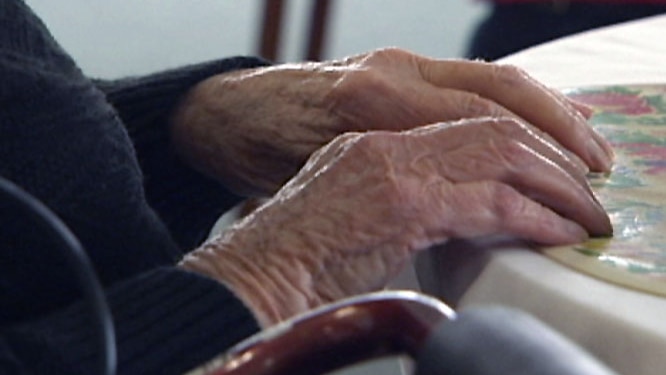 old woman's hands on table generic aged care
