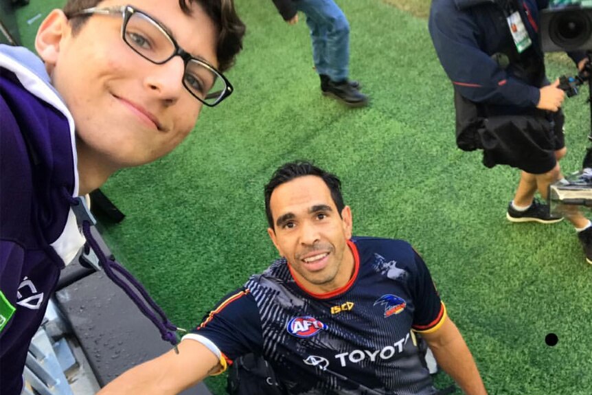 A photo of Eddie Betts with a football fan after the Adelaide Crows game against Fremantle on Sunday.