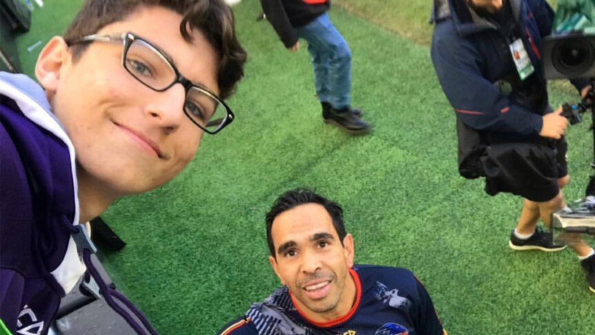A photo of Eddie Betts with a football fan after the Adelaide Crows game against Fremantle on Sunday.