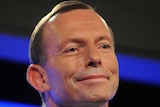 Tony Abbott smiles while addressing the Press Club