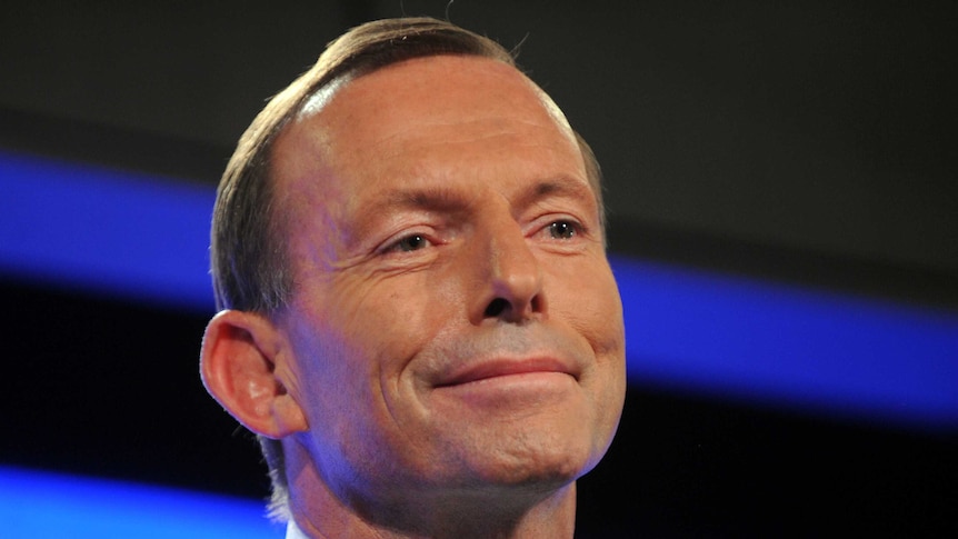 Tony Abbott smiles while addressing the Press Club