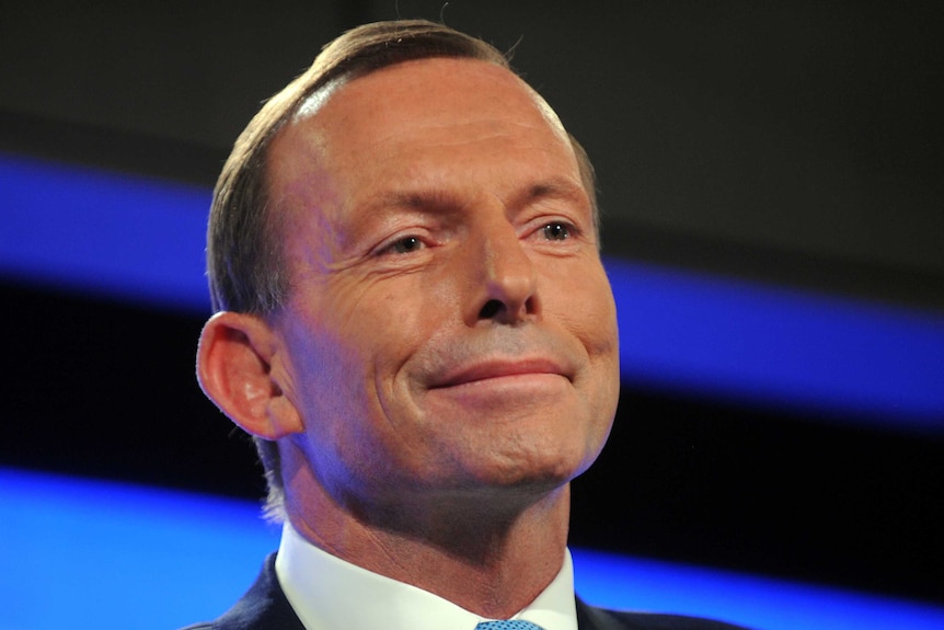 Tony Abbott smiles while addressing the Press Club