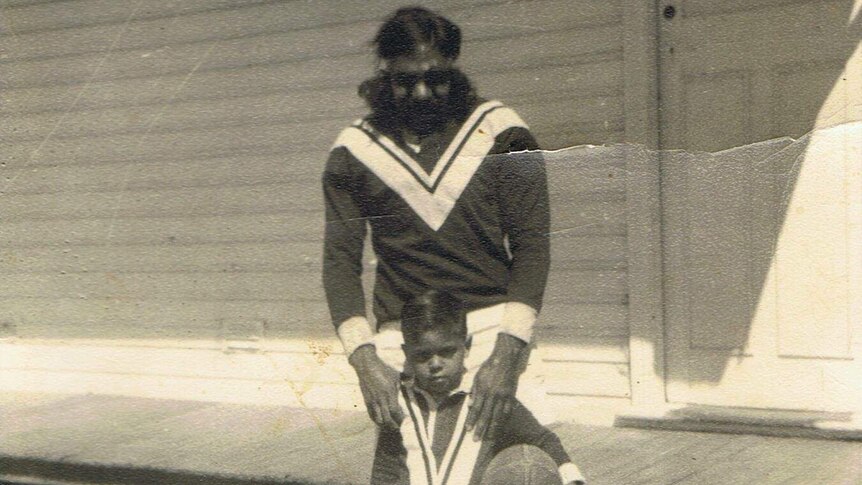 A black-and-white vintage photograph of Henry Simms of the Crookhaven Magpies rugby league team. He is seen with his nephew.