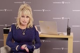 Dolly Parton sings altered version of her hit song "Jolene" as she receives her first dose of Moderna vaccine
