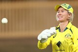 Australia wicketkeeper Beth Mooney throws a cricket ball during a Twenty20 against Pakistan.