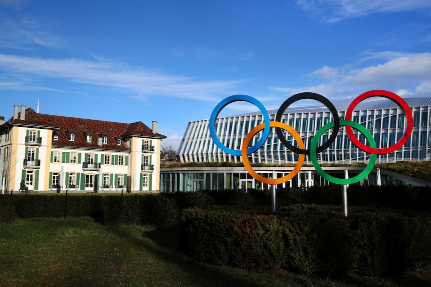 The five multicoloured Olympic rings stand in front of the headquarters of the IOC in Switzerland.