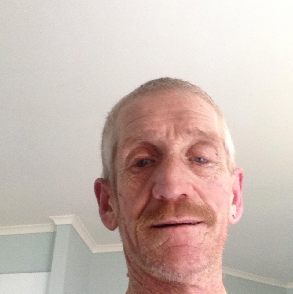 Darren Clover smiles at the camera.