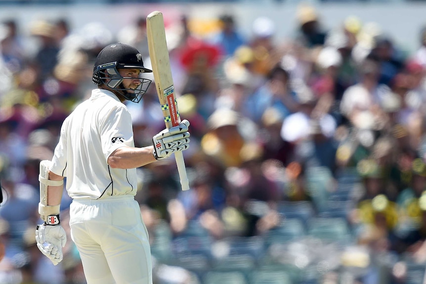 Kane Williamson raises his bat