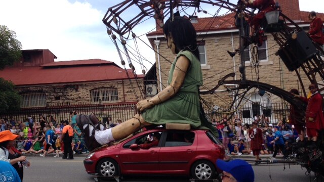 The little girl rides on a car on Hay Street, Perth.