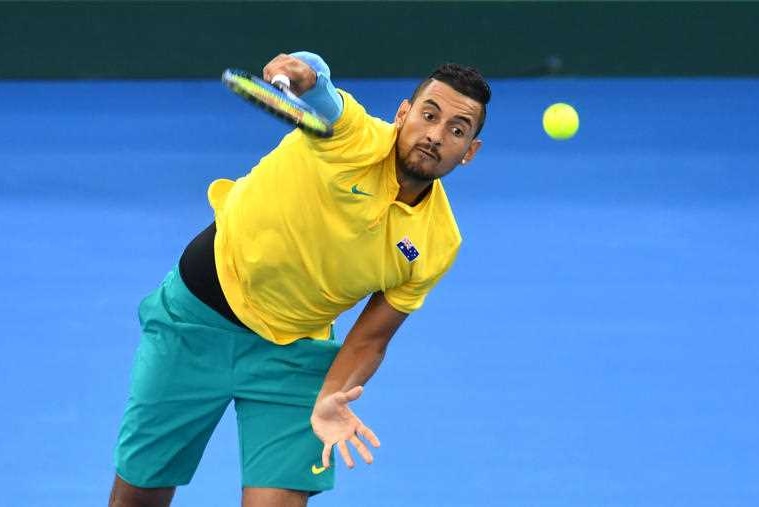 Nick Kyrgios is seen serving from front-on.