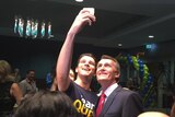 A Team Quirk supporter gets a selfie with Brisbane Lord Mayor Graham Quirk