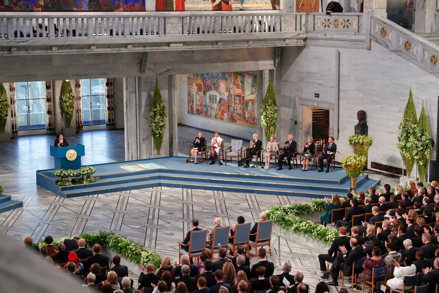 A wide view of the audience and panel at the Nobel Peace Prize award ceremony.