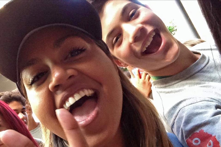 Personality Jessica Mauboy with teenager in background