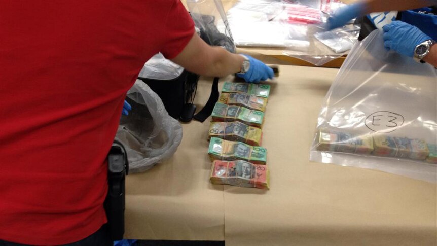 Money seized by police after raid on Brisbane storage shed.