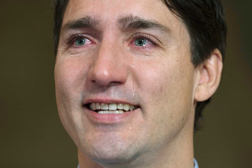 Tears roll down Justin Trudeau's face.