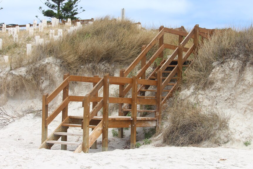Stairs leading onto sand