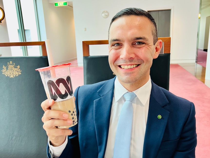 Liberal MP Aaron Violi holds a cup of bubble tea